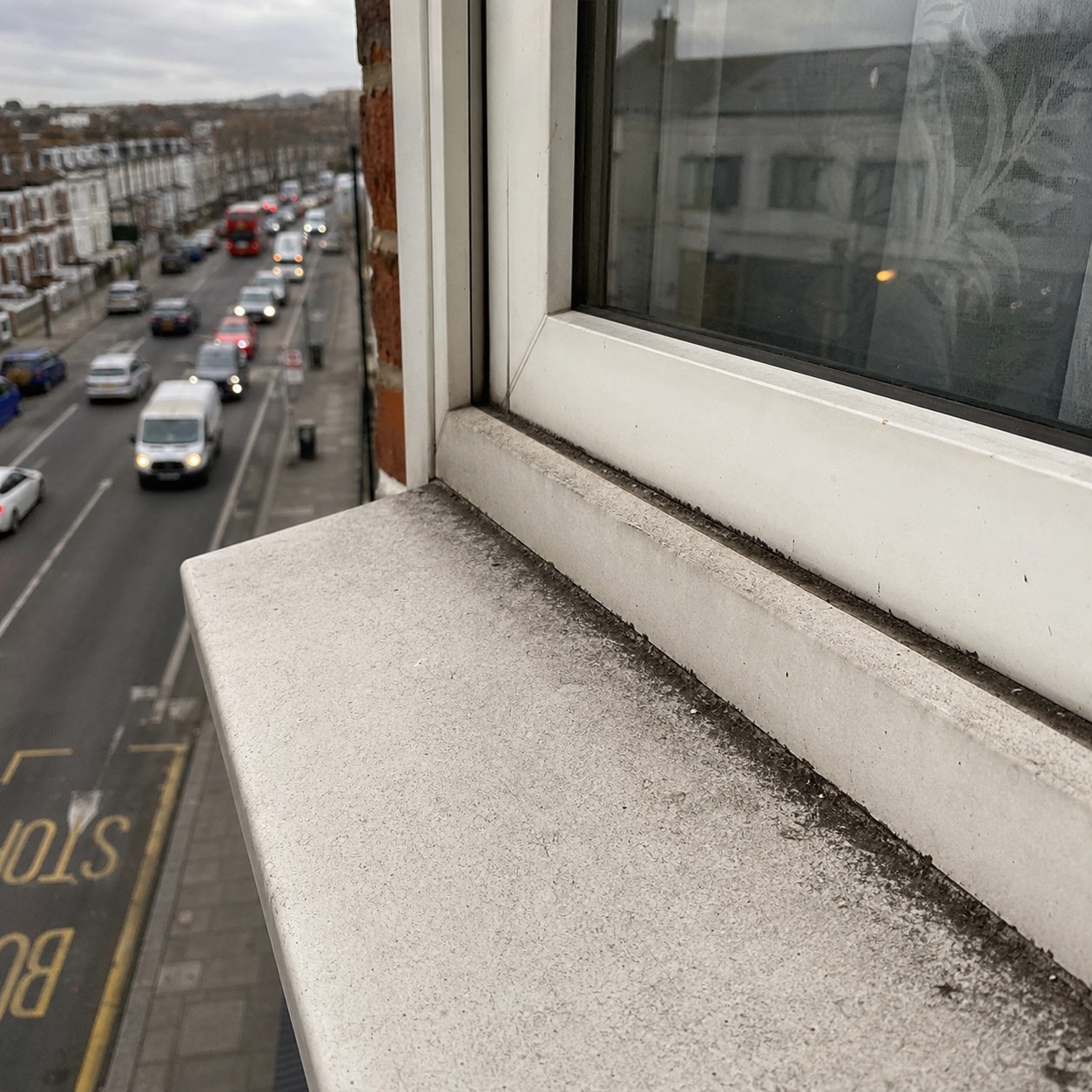 he exterior side of a standard second-floor flat window in North London